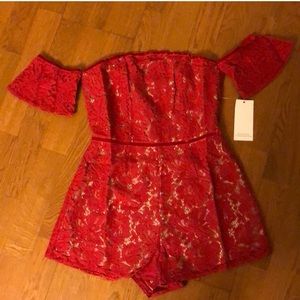 Red off shoulder lace romper
